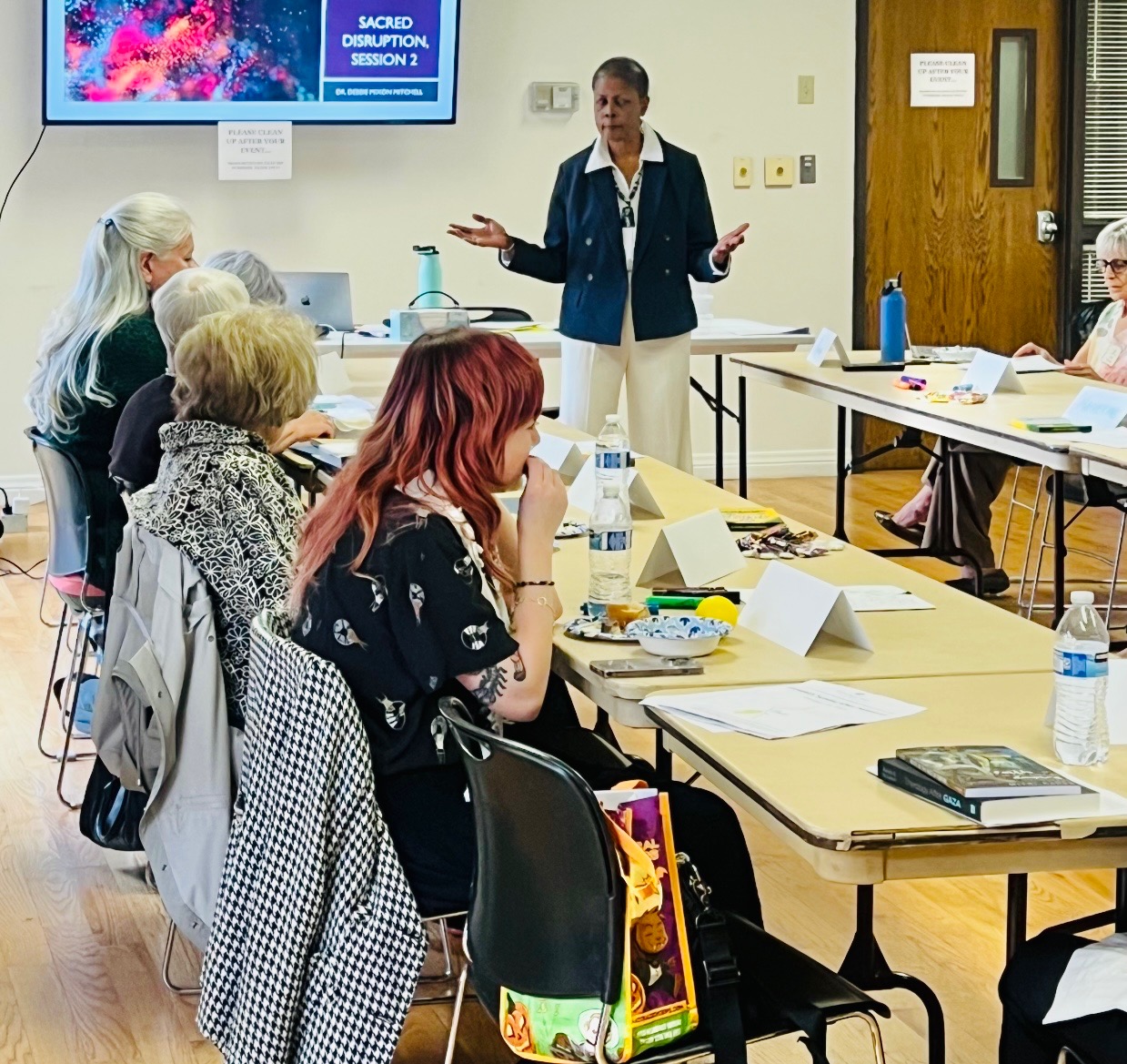 Dr. Debbie facilitating a DEIB workshop with diverse participants